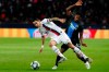 PSG's Angel Di Maria, front fights for the ball by Brugge's Emmanuel Dennis during a Champions League group A soccer match between Paris Saint Germain and Club Brugge, at the Parc des Princes stadium, in Paris, Wednesday, Nov. 6, 2019. (AP Photo/Thibault Camus)