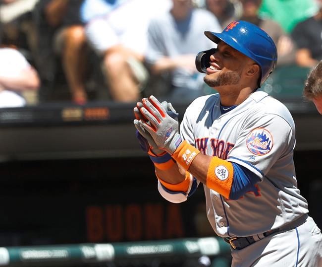 New York Mets' Robinson Cano celebrates his home run off Chicago White Sox starting pitcher Dylan Cease, during the second inning of a baseball game Thursday, Aug. 1, 2019, in Chicago. (AP Photo/Charles Rex Arbogast)