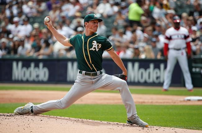 Oakland Athletics starting pitcher Chris Bassitt delivers against the Chicago White Sox during the first inning of a baseball game, Sunday, Aug. 11, 2019, in Chicago. (AP Photo/Kamil Krzaczynski)