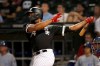 Chicago White Sox's Eloy Jimenez watches his grand slam off Kansas City Royals starting pitcher Jakob Junis during the first inning of a baseball game Tuesday, Sept. 10, 2019, in Chicago. (AP Photo/Charles Rex Arbogast)