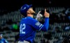 CORRECTS INNING TO SECOND INSTEAD OF FIRST - Kansas City Royals' Hunter Dozier points skyward after hitting a home run during the second inning of a baseball game against the Chicago White Sox, Monday, April 15, 2019, in Chicago. (AP Photo/Matt Marton)