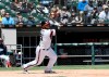 Chicago White Sox's Welington Castillo (21) watches his double against the Detroit Tigers during the first inning of a baseball game, Sunday, April 28, 2019, in Chicago. (AP Photo/David Banks)