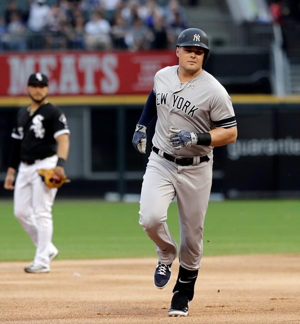 New York Yankees' Luke Voit rounds the bases after hitting a solo home run during the first inning of a baseball game against the Chicago White Sox in Chicago, Friday, June 14, 2019. (AP Photo/Nam Y. Huh)