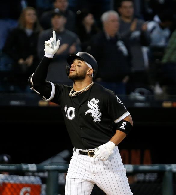 Chicago White Sox's Yoan Moncada celebrates his solo home run against the Cleveland Indians during the third inning of a baseball game Monday, May 13, 2019, in Chicago. (AP Photo/Nuccio DiNuzzo)