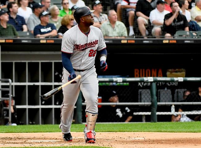Minnesota Twins' Miguel Sano watches his two-run home run during the second inning of the team's baseball game against the Chicago White Sox on Friday, June 28, 2019, in Chicago. (AP Photo/Matt Marton)
