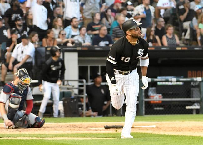 Chicago White Sox's Yoan Moncada (10) watches his home run against the Minnesota Twins during the fifth inning of a baseball game, Saturday, July 27, 2019, in Chicago. (AP Photo/David Banks)