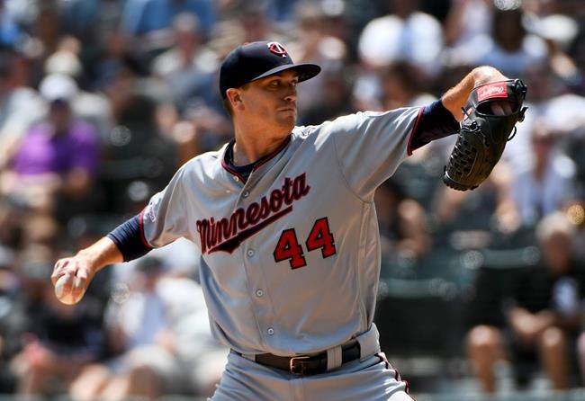 Minnesota Twins starting pitcher Kyle Gibson (44) delivers during the first inning of a baseball game against the Chicago White Sox Sunday July 28, 2019, in Chicago. (AP Photo/Matt Marton)