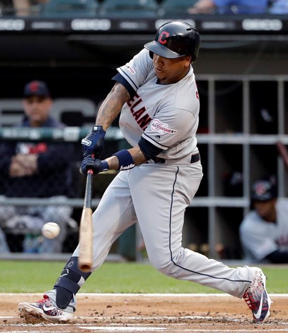 Cleveland Indians' Jose Ramirez hits a double against the Chicago White Sox during the first inning of a baseball game in Chicago, Friday, May 31, 2019. (AP Photo/Nam Y. Huh)