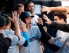 Miami Marlins' Neil Walker celebrates in the dugout after scoring on a double by Starlin Castro during the fourth inning of a baseball game Tuesday, July 23, 2019, in Chicago. (AP Photo/Charles Rex Arbogast)