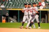 Minnesota Twins left fielder Eddie Rosario (20), center fielder Jake Cave (60) and right fielder Ehire Adrianza (13) walk in from the outfield after their win over the Chicago White Sox in a baseball game Thursday, Aug. 29, 2019, in Chicago. (AP Photo/Mark Black)