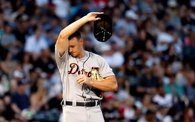 Detroit Tigers starting pitcher Tyler Alexander wipes the sweat from his head during the third inning of a baseball game against the Chicago White Sox Wednesday, July 3, 2019, in Chicago.(AP Photo/Charles Rex Arbogast)
