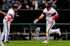 Chicago White Sox's Danny Mendick (20) is congratulated by third base coach Nick Capra, left, after hitting a home run off Los Angeles Angels' Jaime Barria during the fifth inning of a baseball game Sunday, Sept. 8, 2019, in Chicago. (AP Photo/Matt Marton)