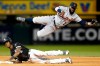 Detroit Tigers second baseman Josh Harrison (1) falls after throwing to first base while Chicago White Sox's Tim Anderson, bottom, is out on a fielder's choice during the fifth inning of a baseball game Friday, April 26, 2019, in Chicago. (AP Photo/Nuccio DiNuzzo)