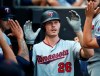 Minnesota Twins' Max Kepler (26) celebrates in the dugout after hitting his second home run of the day against the Chicago White Sox during the seventh inning of a baseball game Saturday, June 29, 2019, in Chicago. (AP Photo/Jeff Haynes)