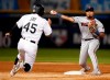 Minnesota Twins second baseman Luis Arraez, right, throws over Chicago White Sox's Jon Jay (45) to complete a double play during third inning of a baseball game Friday, July 26, 2019, in Chicago. (AP Photo/Jeff Haynes)