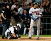 Minnesota Twins' Nelson Cruz (23), right, watches his solo home run during seventh inning of a baseball game as Chicago White Sox catcher James McCann, center, and home plate umpire Chris Segal, left, look on Friday, July 26, 2019, in Chicago. (AP Photo/Jeff Haynes)