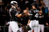 Chicago White Sox's James McCann (33) and relief pitcher Kelvin Herrera (41) celebrate after the White Sox defeated the Texas Rangers 6-1 during a baseball game Thursday, Aug. 22, 2019, in Chicago. (AP Photo/Jeff Haynes)