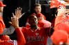 Los Angeles Angels' Justin Upton (8) celebrates in the dugout after hitting a home run off Chicago White Sox's Alex Colome during the ninth inning of a baseball game Friday, Sept. 6, 2019, in Chicago. (AP Photo/Matt Marton)