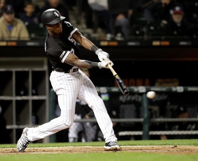 Chicago White Sox's Tim Anderson hits an RBI double off Kansas City Royals relief pitcher Ian Kennedy during the eighth inning of a baseball game Wednesday, May 29, 2019, in Chicago. The White Sox won 8-7. (AP Photo/Charles Rex Arbogast)