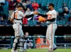Baltimore Orioles relief pitcher Mychal Givens, right, celebrates with catcher Pedro Severino after the Orioles defeated the Chicago White Sox 5-4 in the first game of a baseball doubleheader in Chicago, Wednesday, May 1, 2019. (AP Photo/Nam Y. Huh)