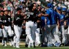 Chicago White Sox's Tim Anderson (7) is restrained by Jose Abreu after he was hit by a pitch from the Kansas City Royals, as benches cleared during the sixth inning of a baseball game in Chicago, Wednesday, April 17, 2019. The Royals won 4-3 in 10 innings. (AP Photo/Nam Y. Huh)