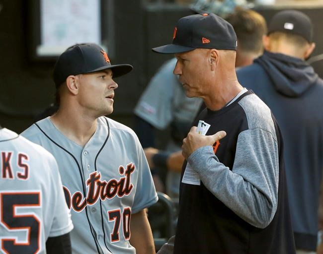 Detroit Tigers bench coach Steve Liddle, right, talks with starting pitcher Tyler Alexander in the dugout, during the fourth inning of a baseball game against the Chicago White Sox Wednesday, July 3, 2019, in Chicago. (AP Photo/Charles Rex Arbogast)