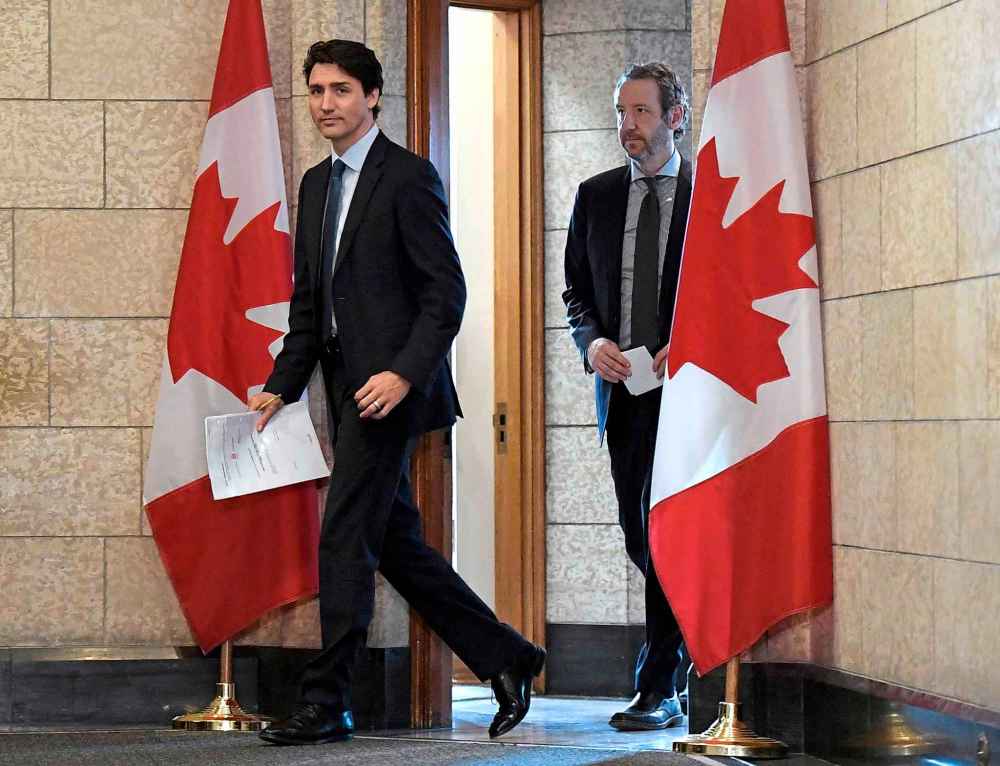 Justin Tang / The Canadian press files
Prime Minister Justin Trudeau leaves his office with his then-principal secretary Gerald Butts in April 2018. Butts resigned last week in the wake of the SNC-Lavalin scandal breaking.