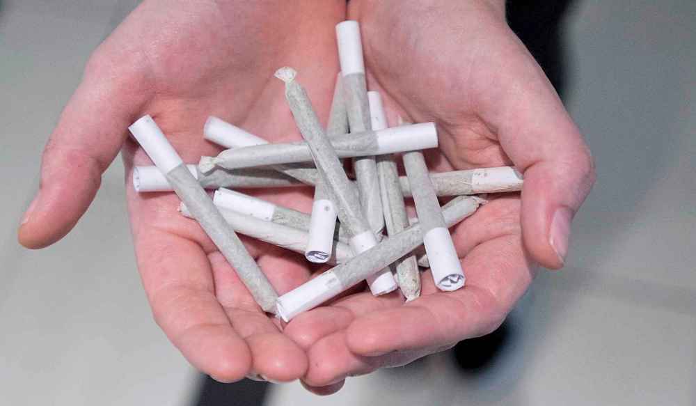 Pre-rolled joints in Canada generally look like this, with filter tips made of rolled paper. (Jonathan Hayward / The Canadian Press files)