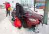 JOE BRYKSA / WINNIPEG FREE PRESS
Steve and Barbra Donovan regroup after losing control of their car in ruts and black ice on Isabel Street at Ross Avenue Tuesday morning.