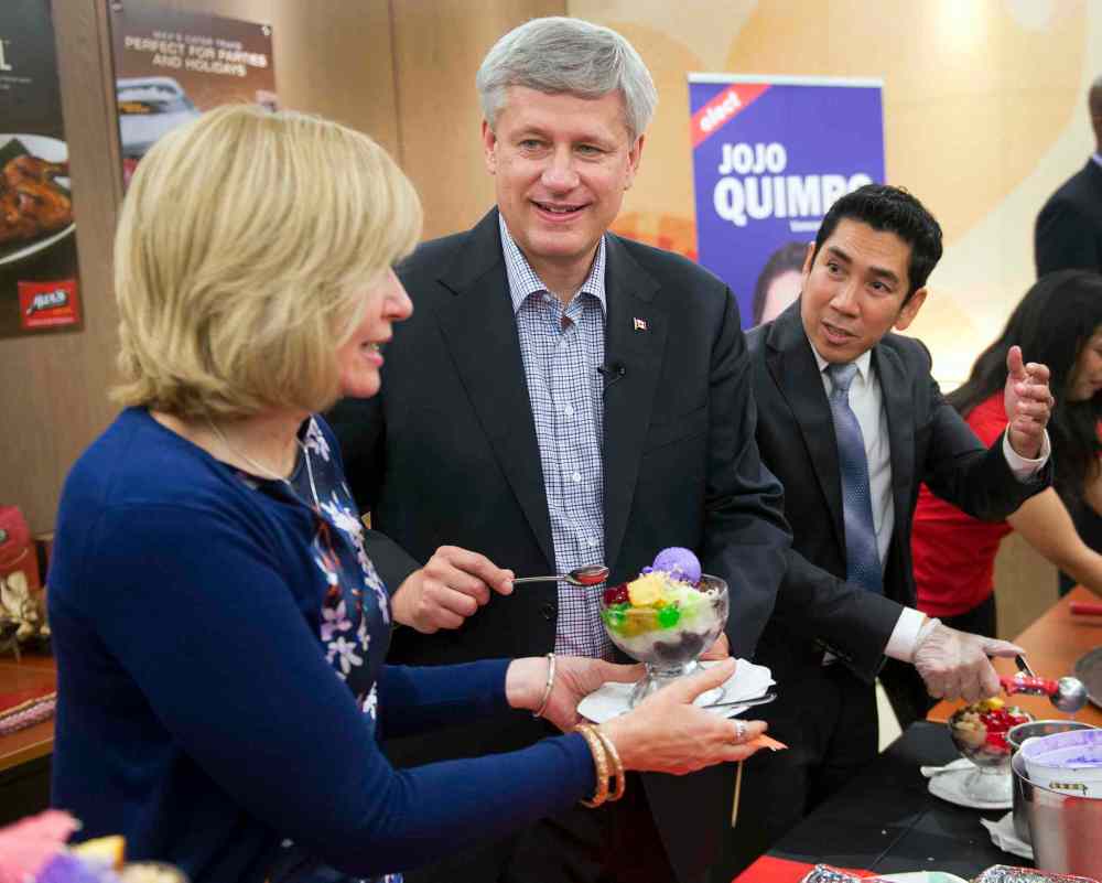 CP
Conservative Leader Stephen Harper and wife, Laureen, serve Halo Halo, a dessert with origins in the Philippines, with local candidate Francisco