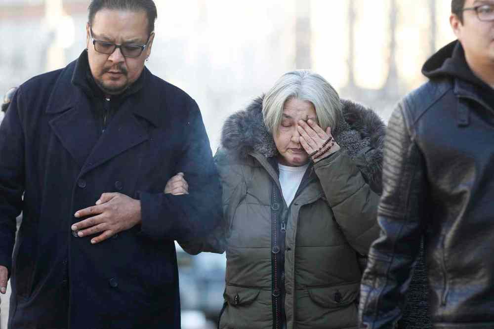 CP
Thelma Favel, centre, Tina Fontaine's great-aunt and the woman who raised her, weeps as she enters the law courts in Winnipeg with Chief Kevin Hart and supporters the day the jury delivered a not-guilty verdict in the second degree murder trial of Raymond Cormier, Thursday, February 22, 2018. THE CANADIAN PRESS/John Woods