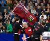 Nathan Denette  / The Canadian Press
Ontario supporter Jack Cox runs through the crowd with his Ontario flag.