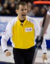 Nathan Denette  / The Canadian Press
Jeff Stoughton celebrates after defeating Brad Gushue on the final shot of the game.