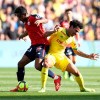 Thiago Mendes of Lille challenges for the ball with Lucas Evangelista of Nantes during a French League One soccer match between Nantes and Lille at La Beaujoire Stadium in Nantes, western France, Sunday, March 31, 2019. (AP Photo/David Vincent)
