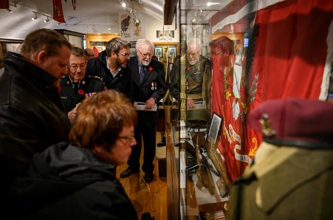 Family and friends of the late Second World War Sergeant Herb Peppard join other members of the military for the unveiling of a new First Special Service Force exhibit featuring Sergeant Peppard's memorabilia at the Army Museum Halifax Citadel in Halifax on Friday, November 8, 2019. THE CANADIAN PRESS/Darren Calabrese