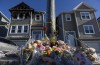 A memorial of flowers and stuffed animal toys is seen outside the scene of a fatal house fire in the Spryfield community in Halifax on Wednesday, February 20, 2019. The early-morning fire claimed the lives of seven Syrian refugee children and left the surviving mother and father in hospital. THE CANADIAN PRESS/Darren Calabrese