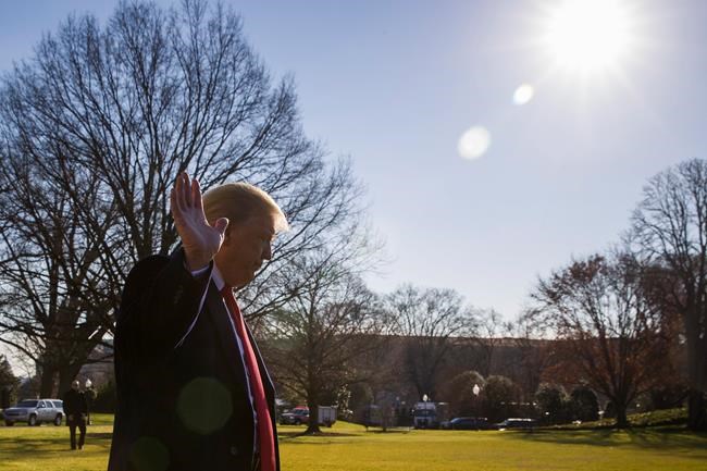 President Donald Trump waves as he departs after speaking on the South Lawn of the White House as he walks to Marine One, Sunday, Jan. 6, 2019, in Washington. Trump is en route to Camp David. (AP Photo/Alex Brandon)