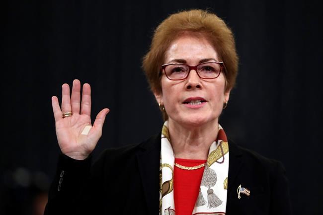 Former U.S. Ambassador to Ukraine Marie Yovanovitch is sworn in to testify to the House Intelligence Committee on Capitol Hill in Washington, Friday, Nov. 15, 2019, during the second public impeachment hearing of President Donald Trump's efforts to tie U.S. aid for Ukraine to investigations of his political opponents. (AP Photo/Andrew Harnik)