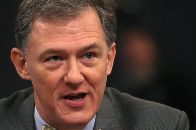 Career Foreign Service officer George Kent testifies before the House Intelligence Committee on Capitol Hill in Washington, Wednesday, Nov. 13, 2019, during the first public impeachment hearing of President Donald Trump's efforts to tie U.S. aid for Ukraine to investigations of his political opponents. (AP Photo/Andrew Harnik)