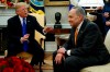 President Donald Trump speaks to Senate Minority Leader Chuck Schumer, D-N.Y., during a meeting with Democratic leadership in the Oval Office of the White House, Tuesday, Dec. 11, 2018, in Washington. (AP Photo/Evan Vucci)