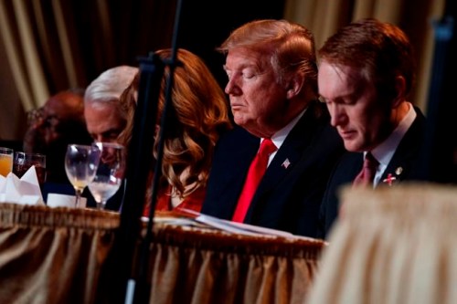 President Donald Trump prays during the National Prayer Breakfast, Thursday, Feb. 7, 2019, in Washington. (AP Photo/ Evan Vucci)