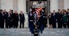 Family members and others watch as the flag-draped of former President George H.W. Bush is carried by a joint services military honor guard to lie in state in the rotunda of the U.S. Capitol, Monday, Dec. 3, 2018, in Washington. (Doug Mills/The New York Times via AP, Pool)