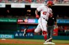 Washington Nationals' Howie Kendrick (47) rounds third as he heads home to score after hitting a homer against the Miami Marlins in the second inning of a baseball game, Sunday, May 26, 2019, in Washington. (AP Photo/Jacquelyn Martin)