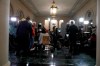 Members of the media set up to cover the House public impeachment hearings Wednesday, Nov. 13, 2019, on Capitol Hill in Washington. With the bang of a gavel, House Intelligence Committee Chairman Adam Schiff will open the hearings into President Donald Trump's pressure on Ukraine to investigate political rivals. (AP Photo/Jacquelyn Martin)