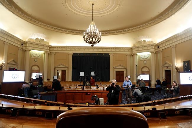 As seen from the dais, photographers prepare in the hearing room where the House will begin public impeachment inquiry hearings Wednesday, on Tuesday, Nov. 12, 2019, on Capitol Hill in Washington. With the bang of a gavel, House Intelligence Committee Chairman Adam Schiff will open the hearings into President Donald Trump's pressure on Ukraine to investigate Democratic rival Joe Biden's family. (AP Photo/Jacquelyn Martin)