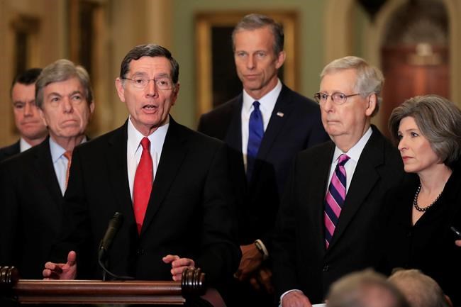 Sen. John Barrasso, R-Wyo., with, from left, Sens. Todd Young, R-In., Roy Blunt, R-Mo., Barasso, John Thune, R-S.D., Senate Majority Leader Mitch McConnell, R-Ky., and Joni Ernst, R-Iowa, speaks to reporters on Capitol Hill in Washington, Tuesday, Feb. 26, 2019. (AP Photo/Manuel Balce Ceneta)