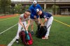David Fox, center, with his sons Dewey, right. and Jimmy gather their equipment as they wrap up practicing baseball at a baseball field in northeast Washington, Friday, Aug. 23, 2019. David Fox and his wife, Mary Ann, have a rule for their sons, 11-year-old Dewey and 8-year-old Jimmy: They have to play a team sport. The kids get to choose which one. Dewey tried soccer and Jimmy had a go at flag football, but every spring and fall, their first choice is baseball. (AP Photo/Manuel Balce Ceneta)