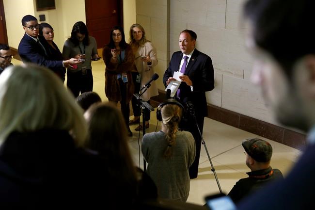 Rep. Lee Zeldin, R-N.Y., speaks with members of the media outside a secure area of the Capitol where Army Lt. Col. Alexander Vindman, a military officer at the National Security Council, arrived for a closed door meeting to testify as part of the House impeachment inquiry into President Donald Trump, Tuesday, Oct. 29, 2019, in Washington. (AP Photo/Patrick Semansky)