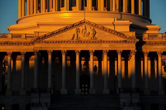 The Capitol is seen at dawn on the 21st day of a partial government shutdown as an impasse continues between President Donald Trump and Democrats over funding his promised wall on the U.S.-Mexico border, in Washington, Friday, Jan. 11, 2019. (AP Photo/J. Scott Applewhite)