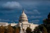 The Capitol is seen beneath dark skies as the House is set to begin public impeachment inquiry hearings as lawmakers debate whether to remove President Donald Trump from office, in Washington, Tuesday, Nov. 12, 2019. (AP Photo/J. Scott Applewhite)